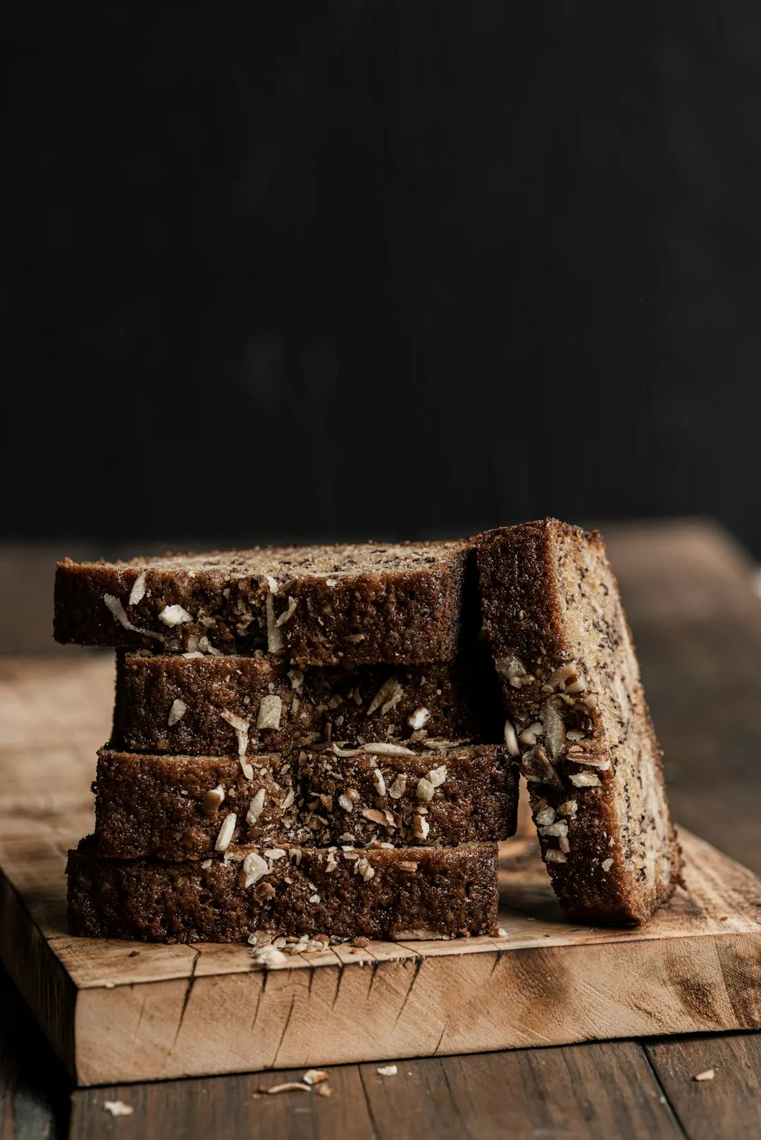 Sliced seeded loaf on a wooden board